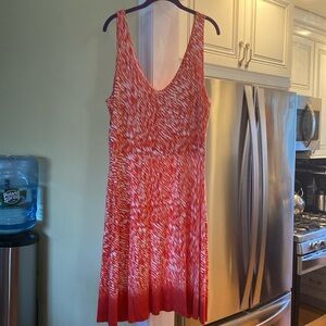 Women’s sleeveless V Neck orange and white design dress. Good condition.
